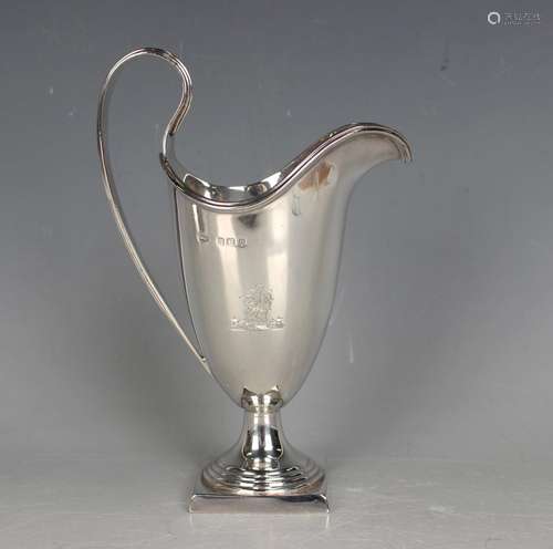 A George V silver helmet cream jug with reeded scroll handle