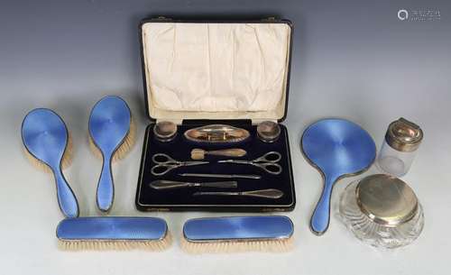 A George V silver and blue enamelled five-piece dressing tab...