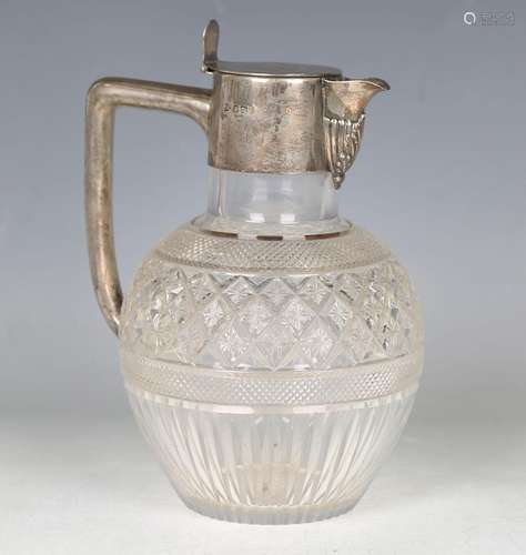 A late Victorian silver mounted cut glass claret jug