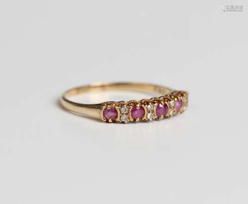 A 9ct gold ruby and diamond half hoop ring