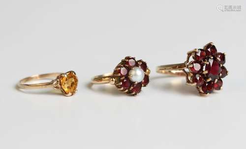 A 9ct gold and garnet nine stone cluster ring