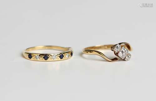 A gold and diamond three stone ring