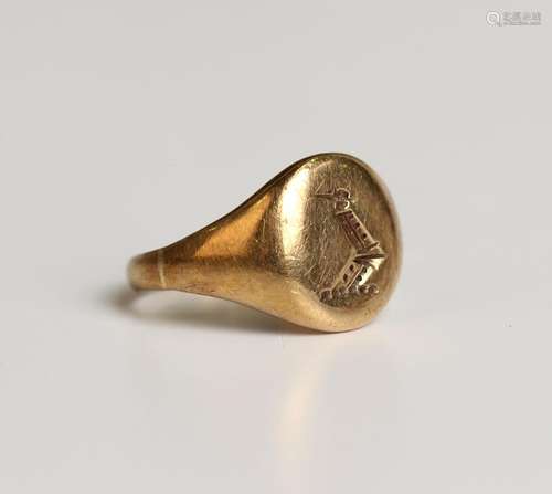 A gold oval signet ring