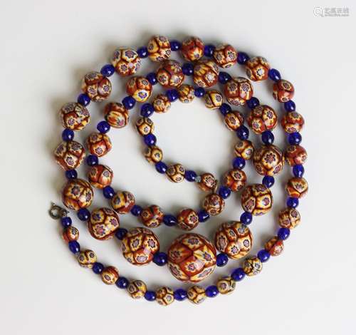 A single row necklace of varicoloured graduated Venetian sty...