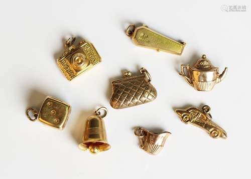 Seven 9ct gold charms