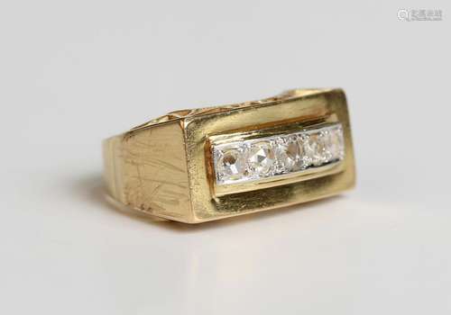 A gold and diamond panel shaped cocktail ring