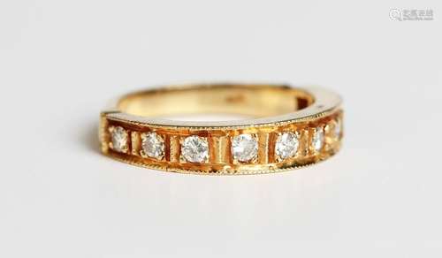 A gold and diamond half hoop eternity ring