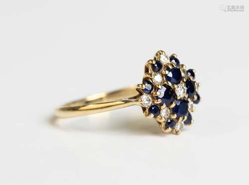 An 18ct gold diamond and sapphire cluster ring