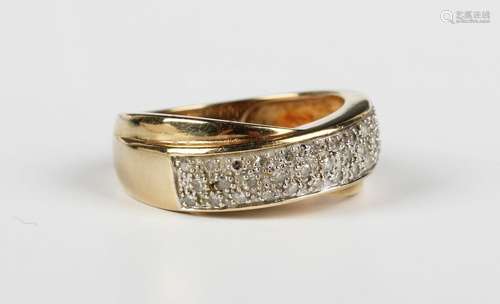 A 9ct gold and diamond ring in a rectangular panel shaped tw...