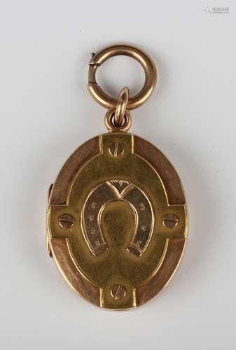 A Victorian two colour gold oval pendant locket