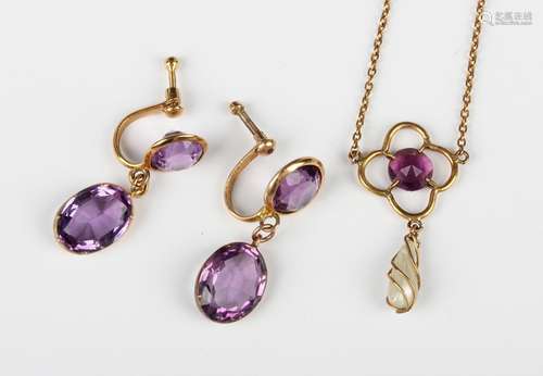 A pair of gold and amethyst two stone earrings