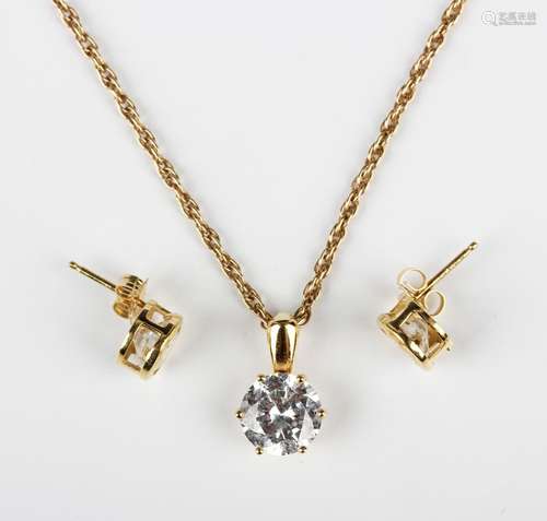 A gold and cubic zirconia single stone pendant