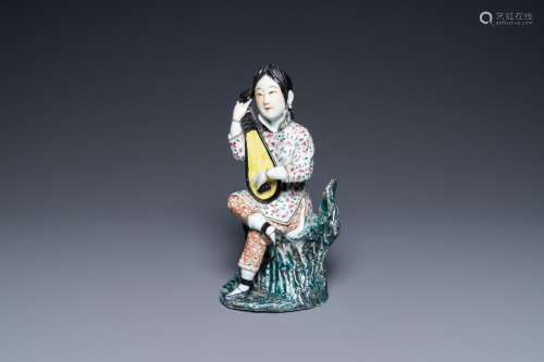 A Chinese famille rose figure of a musician, Fu Jian Hui Gua...