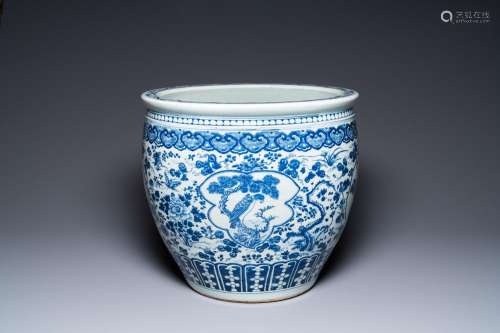 A large Chinese blue and white fish bowl with an eagle and m...