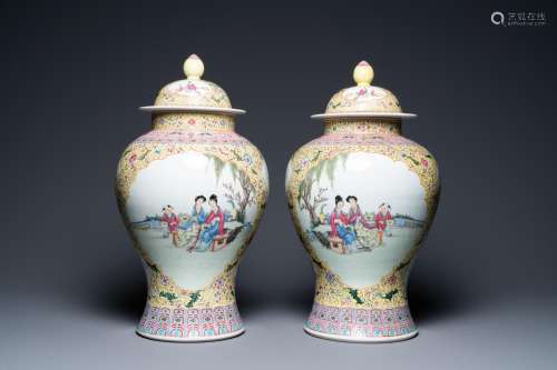 A pair of Chinese famille rose vases and covers, Qianlong ma...