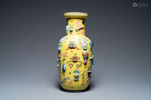 A Chinese yellow-ground famille rose rouleau vase with appli...