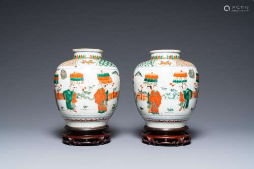 A pair of Chinese famille verte vases on wooden stands, 'har...