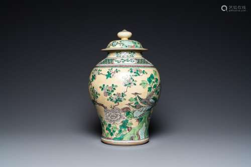 A Chinese yellow-ground verte biscuit vase and cover, 19th C...