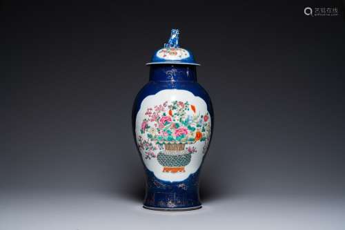 A Chinese blue-ground famille rose vase and cover, Kangxi ma...