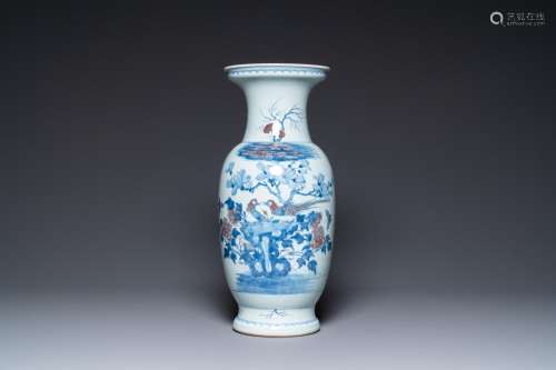 A Chinese blue, white and copper-red vase, 18/19th C.