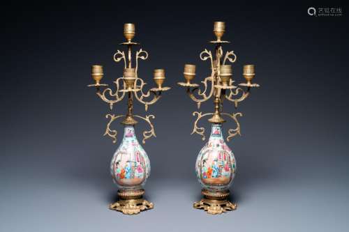 A pair of Chinese gilt brass candelabra-mounted Canton famil...