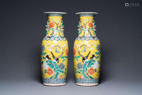 A pair of Chinese yellow-ground famille rose vases, 19th C.