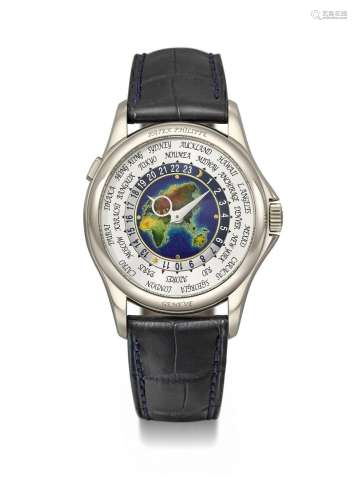 PATEK PHILIPPE. A RARE 18K WHITE GOLD AUTOMATIC WORLD TIME W...