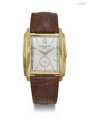 PATEK PHILIPPE. AN ATTRACTIVE 18K GOLD TONNEAU-SHAPED WRISTW...