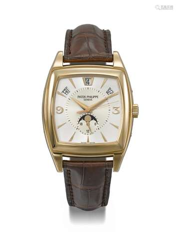 PATEK PHILIPPE. AN ELEGANT 18K PINK GOLD TONNEAU-SHAPED AUTO...