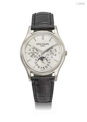 PATEK PHILIPPE. A 18K WHITE GOLD AUTOMATIC PERPETUAL CALENDA...