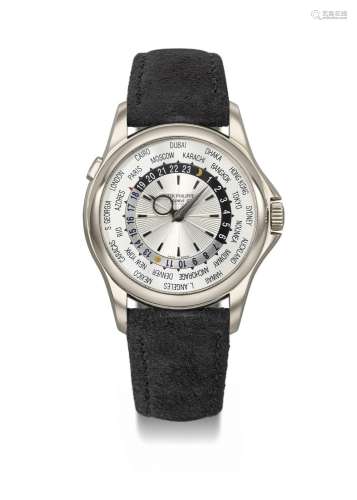 PATEK PHILIPPE. AN ATTRACTIVE 18K WHITE GOLD AUTOMATIC WORLD...