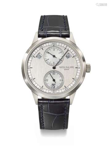 PATEK PHILIPPE. AN ATTRACTIVE 18K WHITE GOLD AUTOMATIC ANNUA...