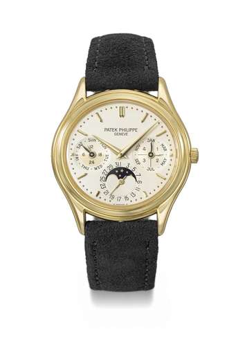 PATEK PHILIPPE. AN ELEGANT 18K GOLD AUTOMATIC PERPETUAL CALE...