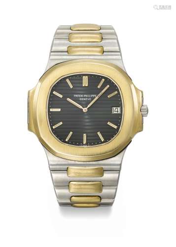 PATEK PHILIPPE. A VERY RARE 18K GOLD AND STAINLESS STEEL AUT...