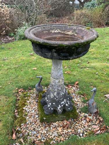 A circular reconstituted stone bird bath, diameter 56cm, hei...