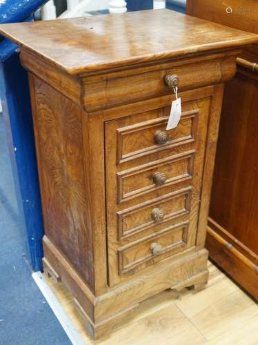 A 19th century French elm bedside cabinet with dummy drawer ...