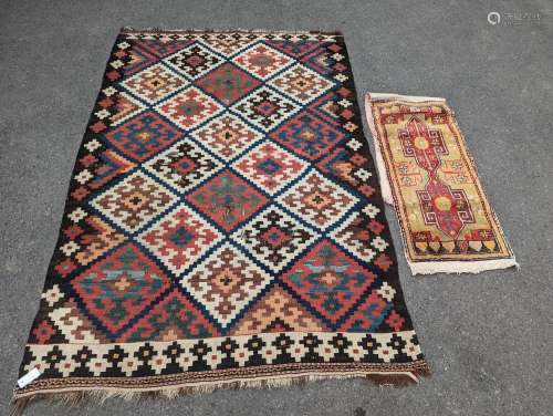 A Persian tribal Kelim carpet, 230 x 158cm and a Turkish bag
