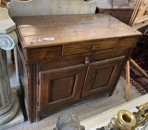 An 18th century and later oak and fruitwood side cabinet, wi...