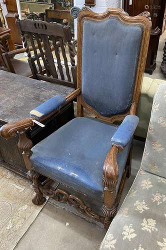 A Carolean style oak upholstered open armchair, width 65cm, ...