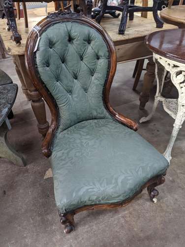 A Victorian walnut spoon back nursing chair