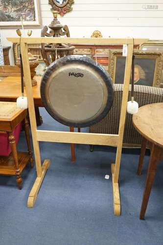 A Paiste 56cm. gong and a pair of Paiste M3 mallets, on purp...