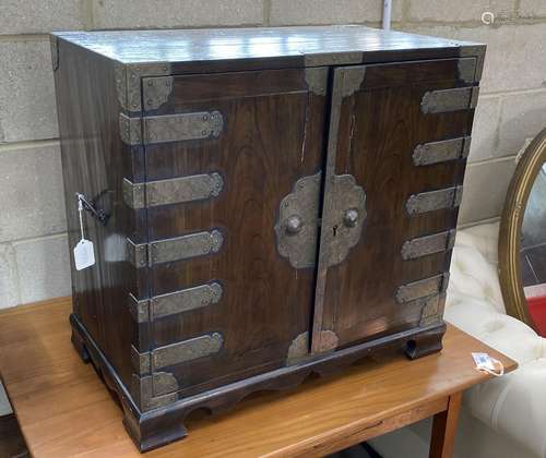 A Korean brass mounted pine table cabinet fitted with an arr...