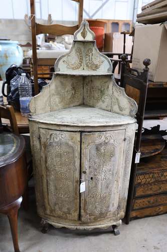 An 18th century Italian painted carved pine bow front standi...