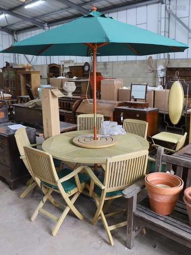 A teak garden set comprising circular table 148 cms diameter...