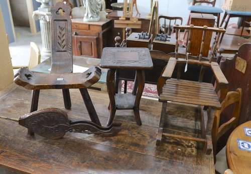 A small childs oak rocking chair, a pair of carved wood bell...