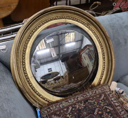 A large Regency circular giltwood and gesso convex wall mirr...