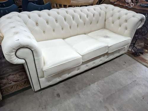 A Victorian style buttoned white leather Chesterfield settee...