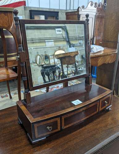 A Regency satinwood banded mahogany bow fronted toilet mirro...