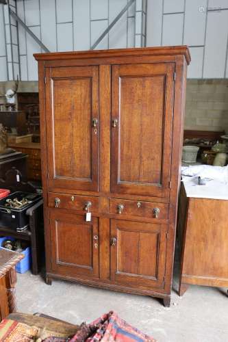 An early 19th century Welsh panelled oak household cabinet. ...