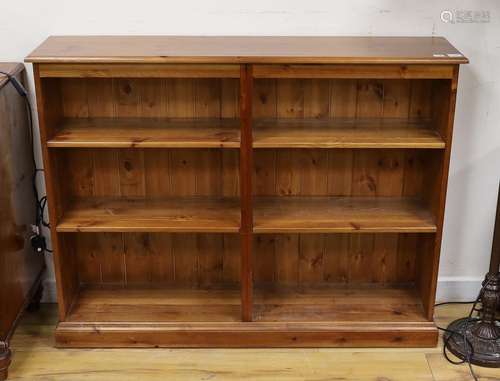 A modern pine open fronted bookcase, length 130cm, depth 29c...